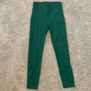 Lululemon yoga pants. Green. Size 4. Hidden waistband pocket and side pockets.